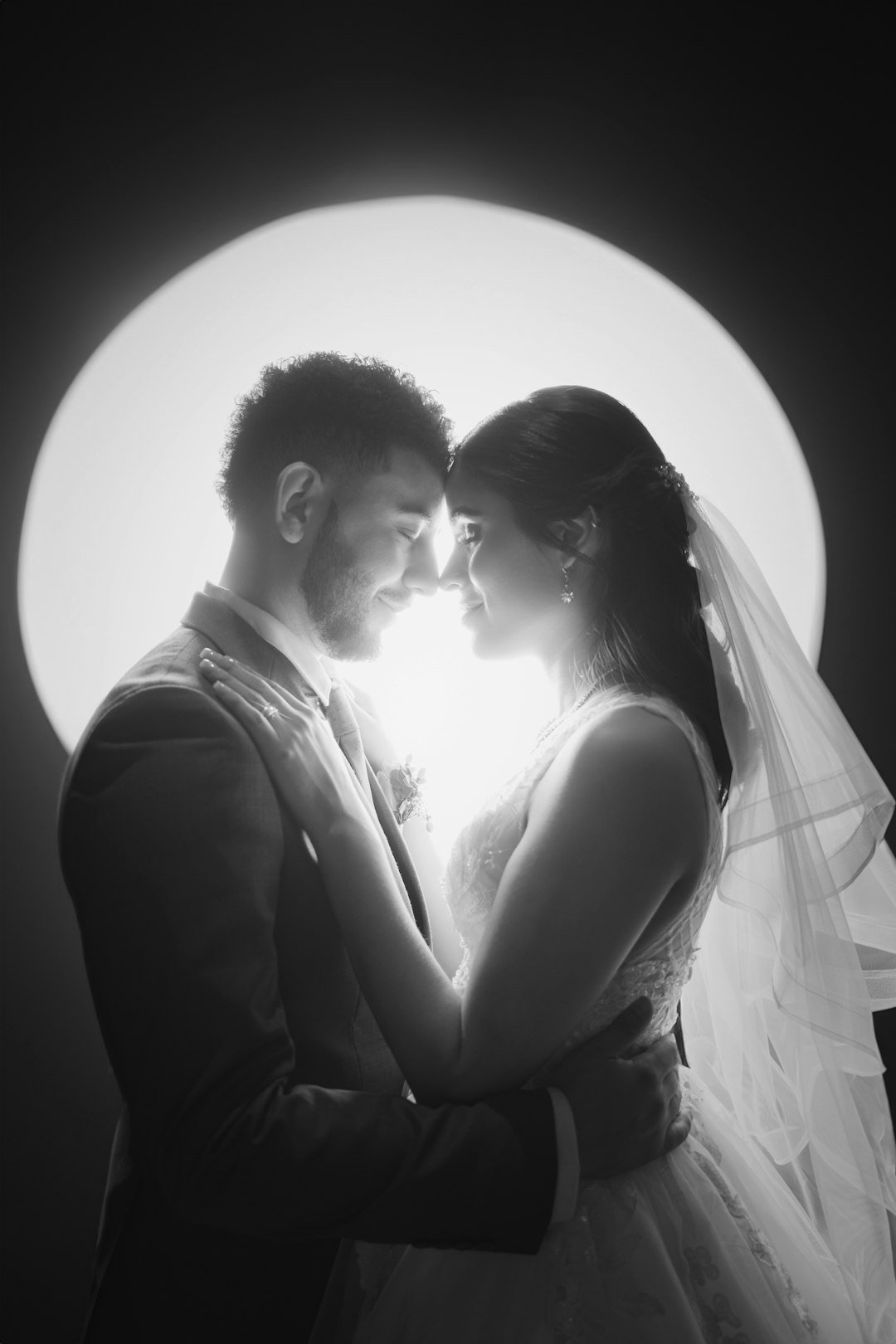 Black and white portrait of a wedding couple standing together