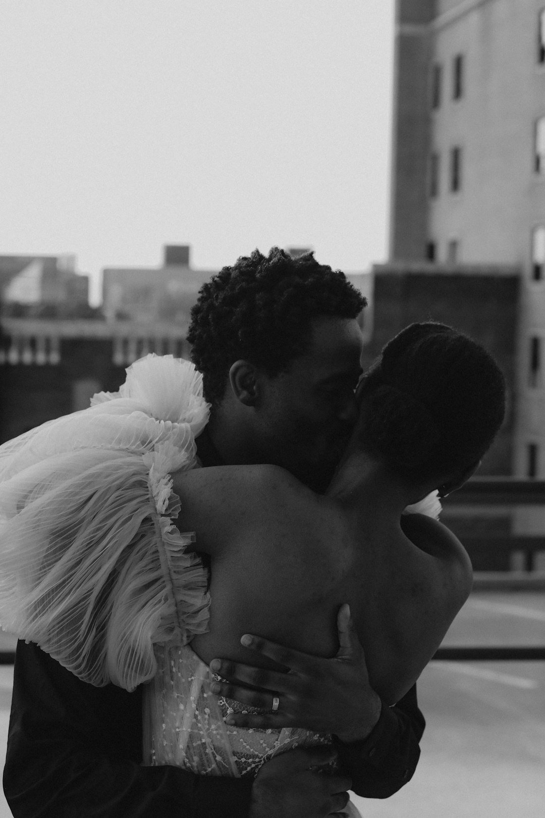Groom kissing the bride's forehead