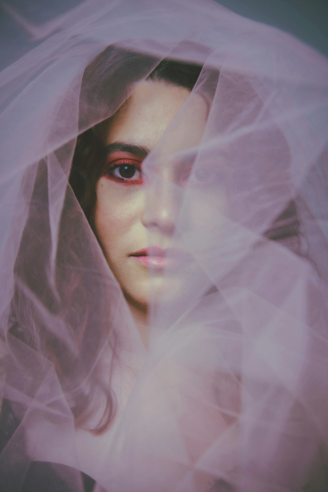 Bride behind a sheer white veil